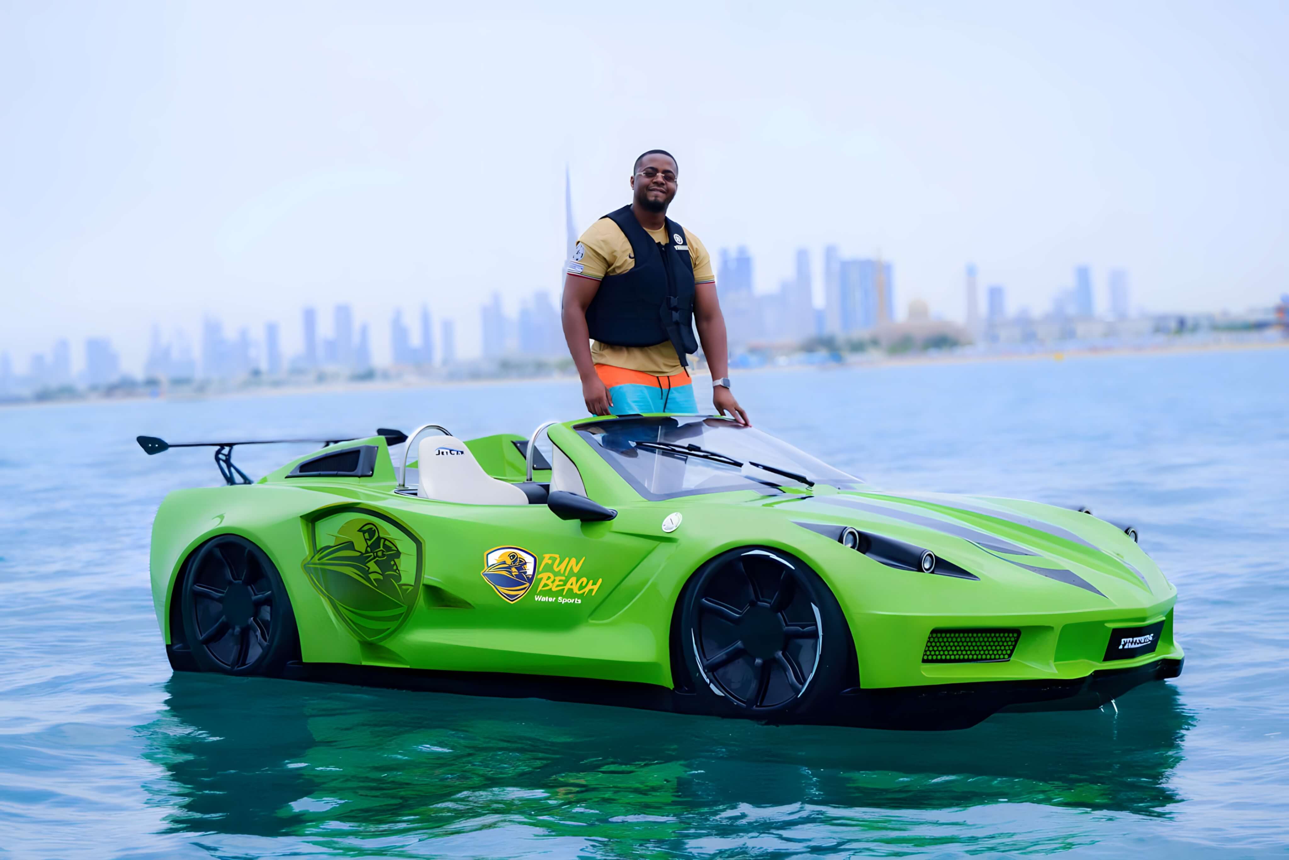 Green luxury jet car speeding across the water in Dubai